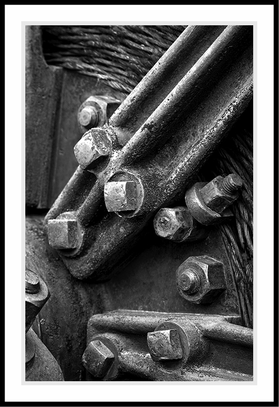Nuts and bolts on heavy machinery.